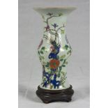 A Chinese polychrome porcelain vase. 20th century. Measures cm. 31 x 20. VASO IN PORCELLANA A SMALTI