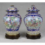 A pair of Chinese cloisonnè metal vases. 20th century. Measures cm. 38 x 28. COPPA DI VASI IN