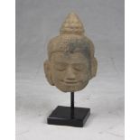 A Kmer carved sandstone Buddha's head. Cambodia, 12th - 13th century. h. cm. 21 x 14 x 14. TESTA