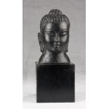 A Chinese stone head, depicting Buddha. 20th century. Measures cm. 20 x 12 x 12. TESTA IN PIETRA,