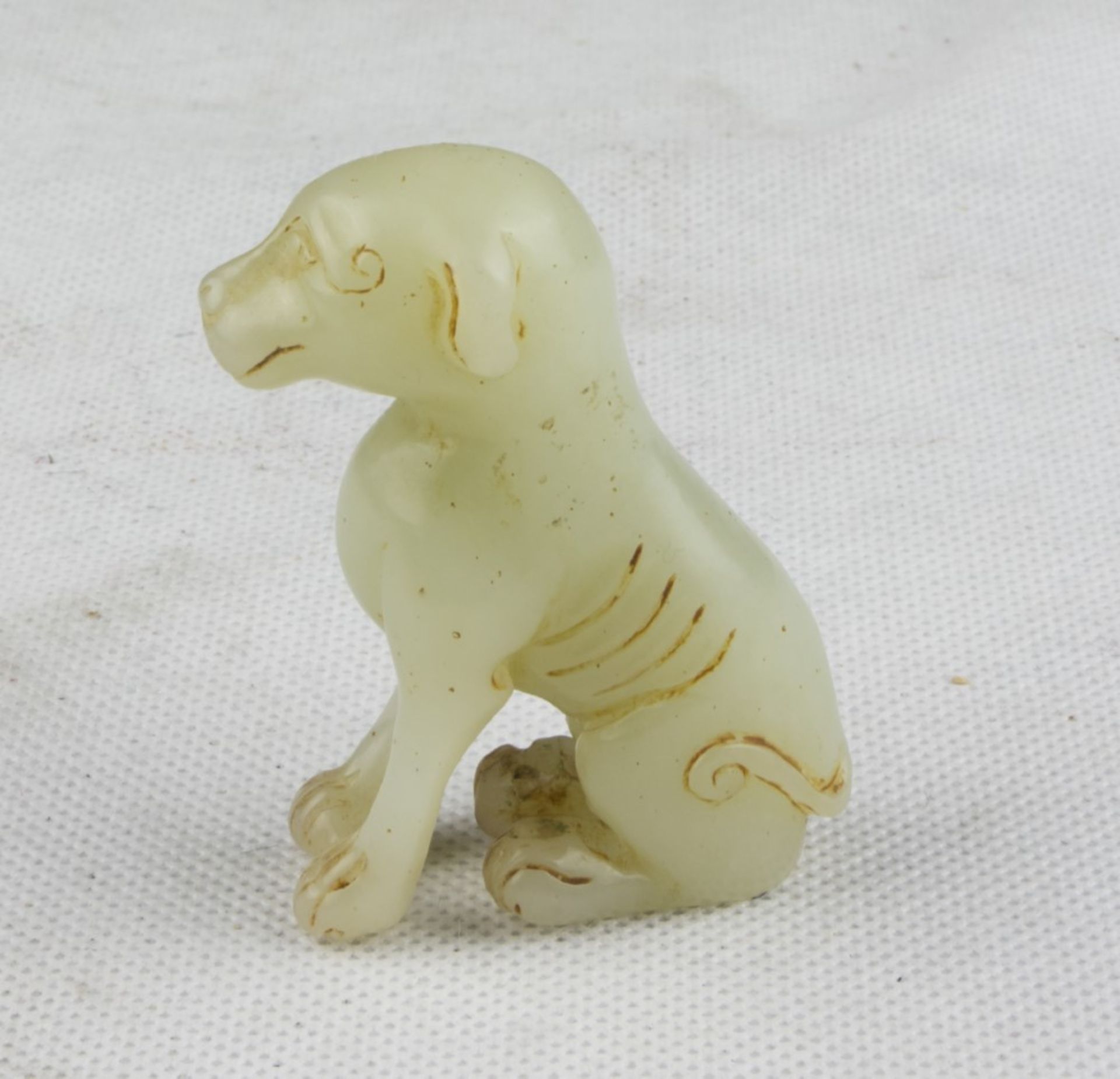 A Chinese jade sculpture dipcting dog. 20th century. Measures cm. 7 x 2 x 4. SCULTURA IN GIADA, CINA