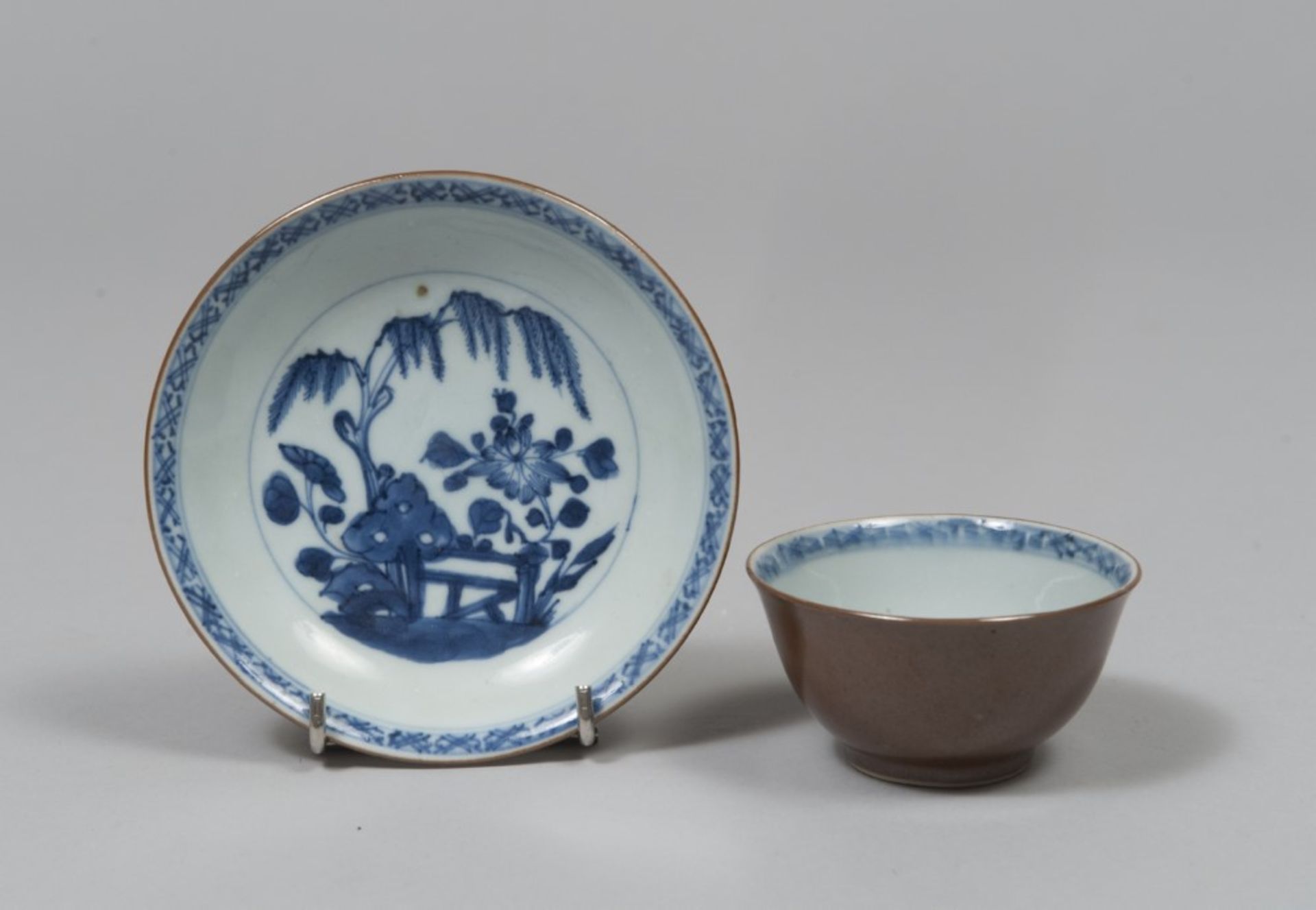 A CHINESE WHITE AND BLUE PORCELAIN CUP AND SAUCER, 19TH CENTURY Measures cup cm. 5 x 9, diameter