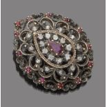 BROOCH in gold and silver, molded like a boquet bloomed in ruby __and pink cut diamonds. Measures