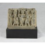 A Gandhara schist bas-relief, depicting Buddha's birth. 2nd - 3rd century. Measures cm. 16 x 26 x 5.