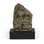 An Hindi schist sculpture, depicting Shiva and Parvati. 2nd - 3rd century. Measures cm. 25 x 17 x