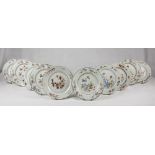 Ten gold and polychrome enamel porcelaine dishes. 18th century. Diameter cm. 23. DIECI PIATTI IN