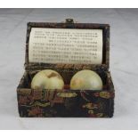 A pair of Chinese hard stone spheres. 20th century. In case. Measures case cm. 6 x 12 x 7. DUE