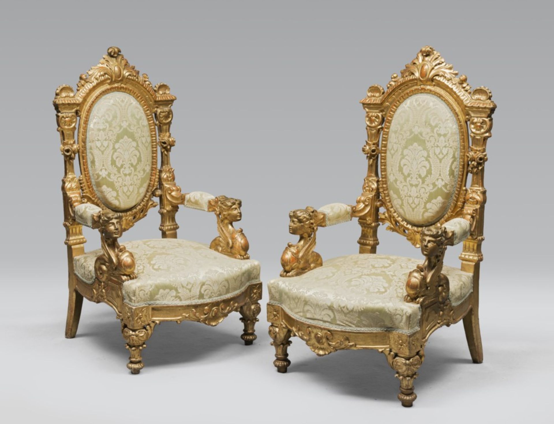 PAIR OF GILDED ARMCHAIRS, PROBABLY ROME, 19TH CENTURY architectural Medallion carved backs,