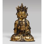 A Chinese gilded bronze sculpture, depicting Guanyin, early 17th century. Measures cm. 35 x 23 x 14.