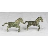 A pair of Chinese bronze sculptures, depicting horses. 20th century. Measures cm. 11 x 15 x 4.