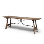 Nice Walnut table, central Italy 17th century With a thick rectangular top. Lyre leg with gleaned