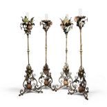 FOUR RARE IRON FLOOR-CANDLESTICKS, 18TH CENTURY with polygonal node in bronze. Cimasa with leafy and