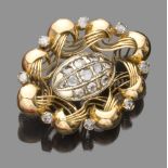 BEAUTIFUL BROOCH in 18 kt yellow gold, modeled with a stylized flower basket with set pink diamonds.