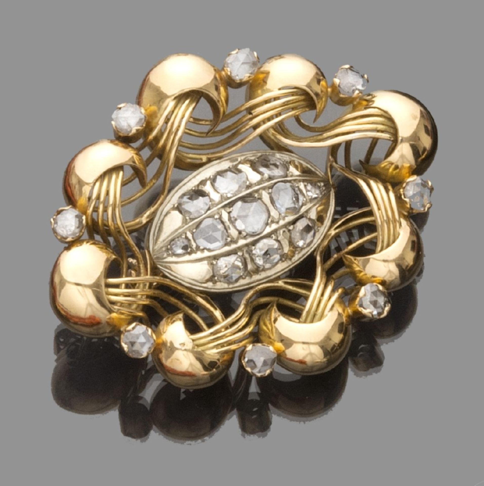 BEAUTIFUL BROOCH in 18 kt yellow gold, modeled with a stylized flower basket with set pink diamonds.