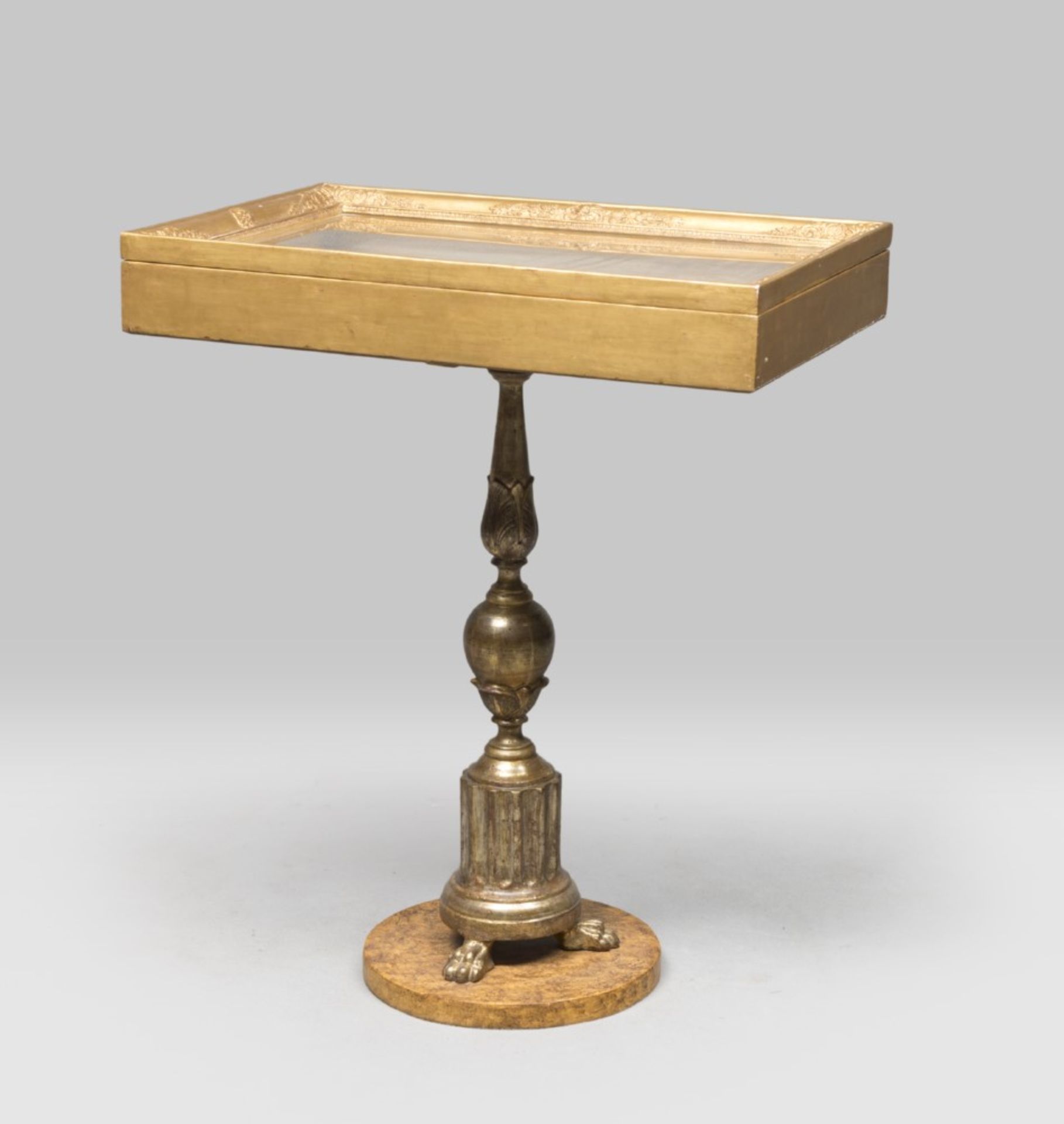 TABLE-SHOWCASE, ANTIQUE ELEMENTS in gilded wood, with leg consists of rostral candlestick. Framed