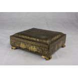 A Chinese gold and black laquer wood box. Second half 19th century. Misure totali cm. 12 x 31 x