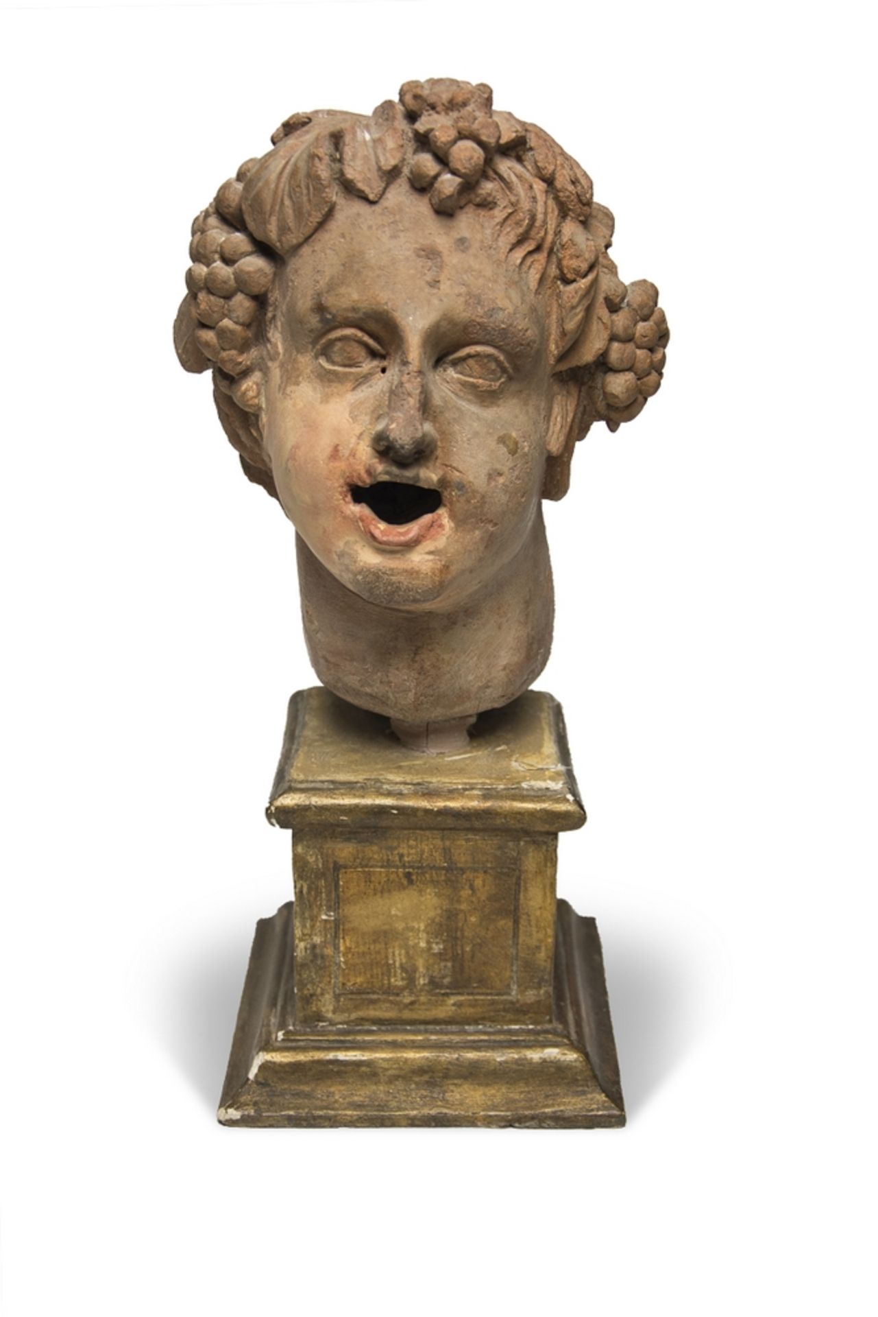 EARTHENWARE BACCHIC HEAD, 19TH CENTURY complete with gilded wooden base. Measures cm. 23 x 12 x