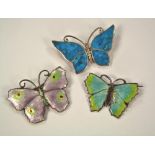 BUTTERFLY PINS. Two silver & enamel butterfly pins, another set with polished stone.