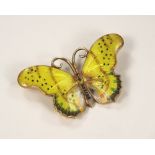 ENAMELLED PIN. A silver gilt & enamelled butterfly pin. Max. width 5cm.