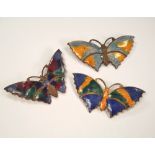 BUTTERFLY PINS. Three stamped brass & enamelled butterfly pins. Largest 6cm.