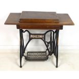 A Victorian Jones Medium CS sewing machine and oak treadle table, serial 151522, in good condition,