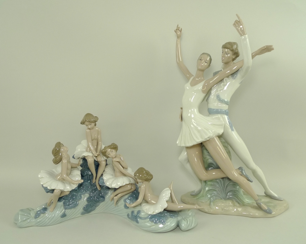 A Nao porcelain figural group modelled as a male and female ballet dancer, 23 by 13 by 40cm,