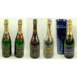 A group of five bottles of vintage champagne, comprising two bottles of Moet & Chandon Champagne,