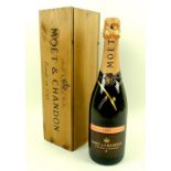 A bottle of Moet & Chandon, Rose, Grand Vintage 2000, in wooden presentation case.