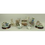 A group of Lladro porcelain figurines comprising a child and treasure chest of flowers,