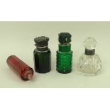 A collection of three Victorian glass perfume bottles comprising a double ended decogan cranberry