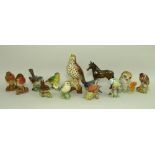 A collection of Beswick figurines of birds, comprising two Robins 980, one matt one gloss,