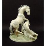 A Sitzendorf porcelain horse figural group of a dappled grey stallion and mare, model number 11963,