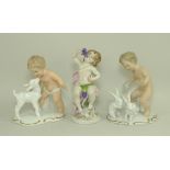 A pair of Wallendorf porcelain figures of Putti, one with a lamb, number 1380,