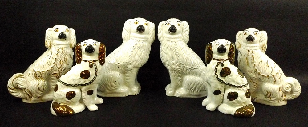 A pair of Staffordshire King Charles spaniel fire dogs, in white ground with lustre glaze, 28cm,