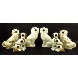 A pair of Staffordshire King Charles spaniel fire dogs, in white ground with lustre glaze, 28cm,