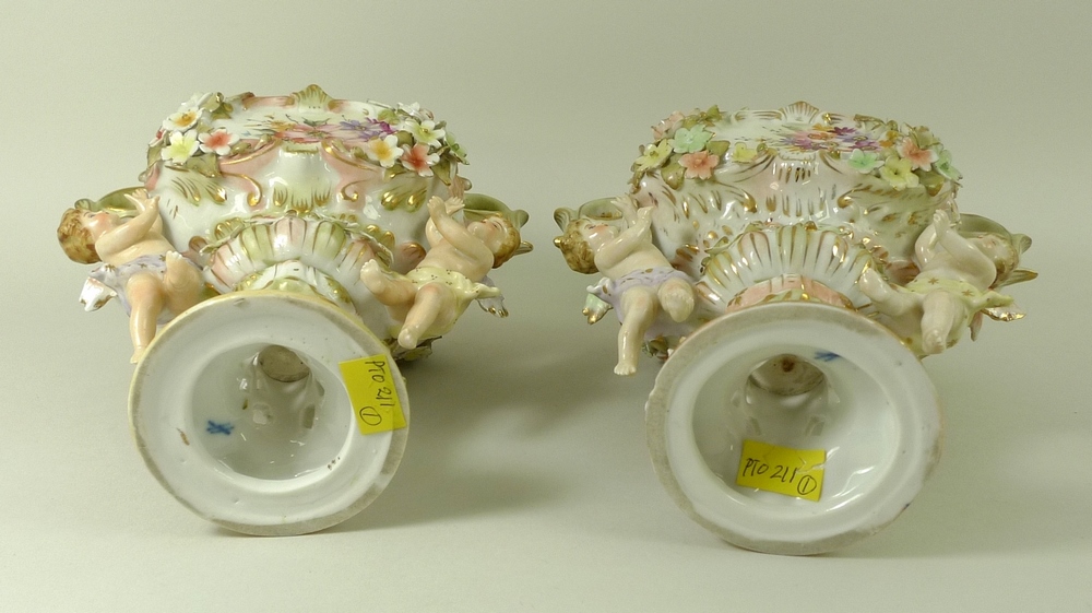 A pair of Sitzendorf lidded vases, decorated in high relief with flowers and pair of putti, - Image 8 of 8