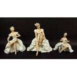 A group of three Wallendorf porcelain figures, comprising a seated ballerina tying her shoe ribbon,