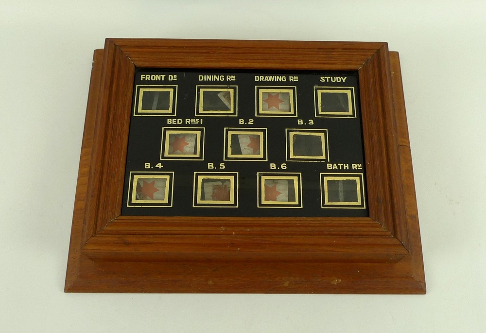 A servant's electric bellboard indicator, circa 1930's, with gilt ...