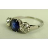 A platinum, diamond and sapphire three stone ring with central sapphire of approximately 1.