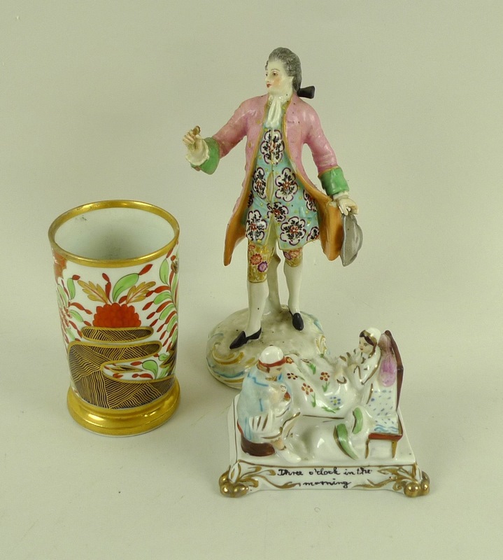 A 19th century Continental painted porcelain figure of a French nobleman with pink frock coat,