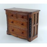 A late 19th or early 20th century mahogany, ebony and fruitwood apprentice or salesman's chest,