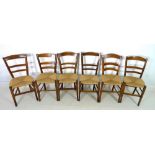 A set of six 19th century oak and elm country dining chairs, with rush seats,