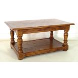 A modern pollard oak coffee table, rectangular three plank surface with moulded edge,