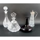 A claret jug, the pressed glass body mounted with silver plate collar, spout and lid,