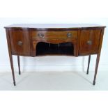 A George III mahogany, line inlaid and crossbanded sideboard, with serpentine shaped front,