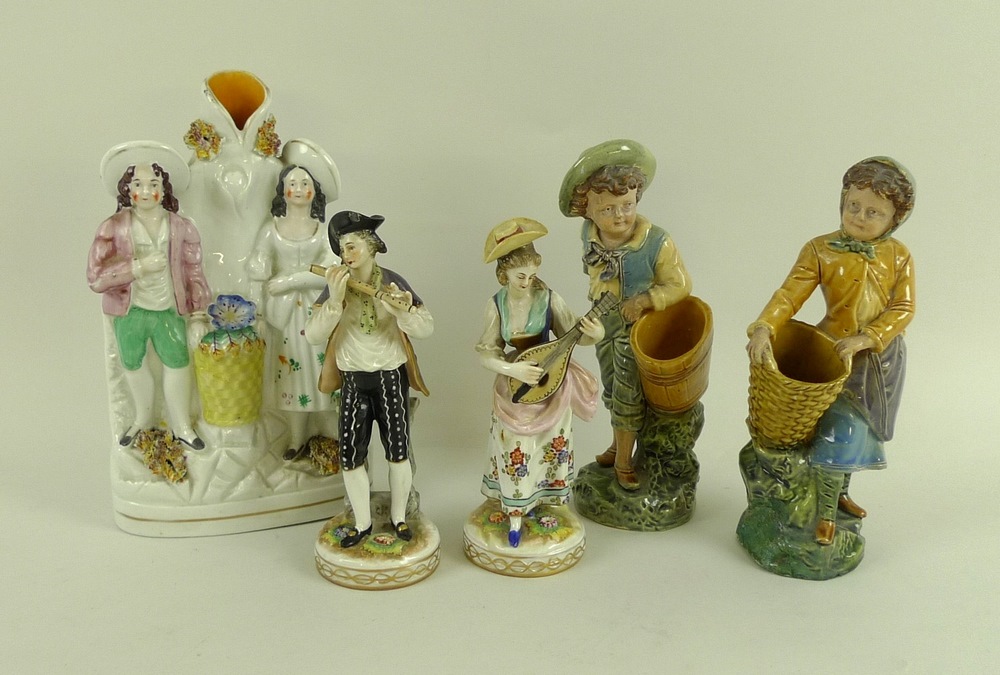 A group of 19th century ceramic figurines, comprising a Staffordshire figural stem vase,