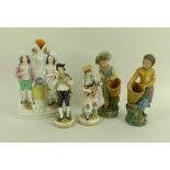 A group of 19th century ceramic figurines, comprising a Staffordshire figural stem vase,