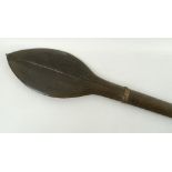 A Solomon Islands hardwood paddle, the leaf blade carved with central vein,