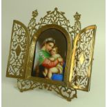 A late 19th century devotional, containing a painted porcelain plaque, of domed rectangular form,