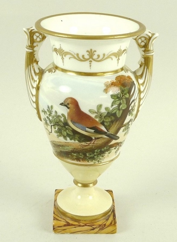 A porcelain urn, circa 1780, possibly Spode, with twin moulded handles,
